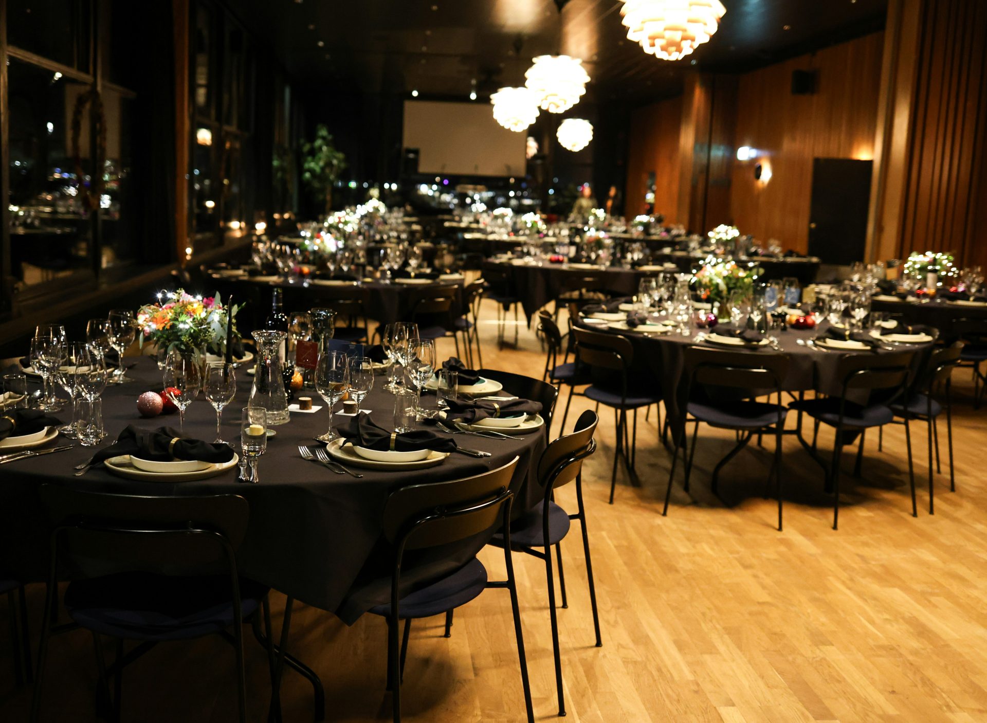 Elegant banquet hall set for a formal dinner event.