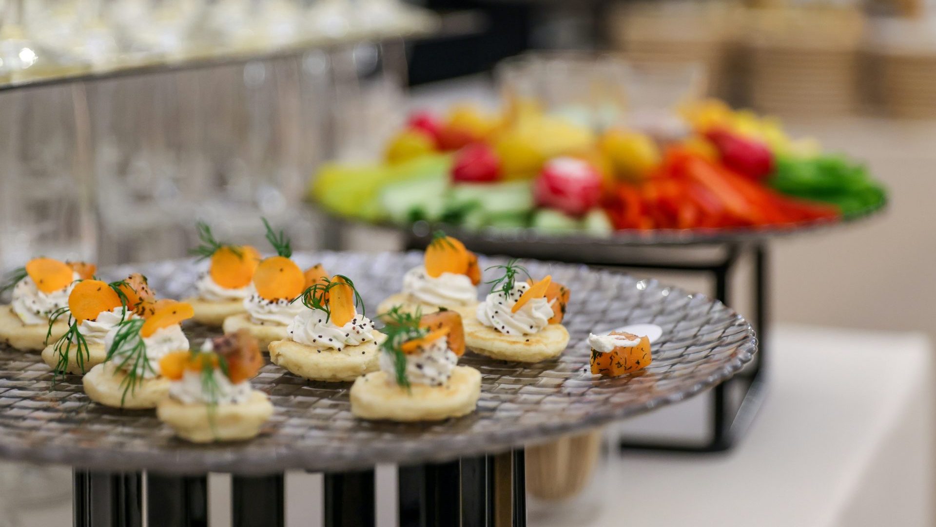 Appetizers with carrots and dill on a platter.